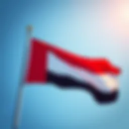 The vibrant flag of the UAE waving against a clear blue sky